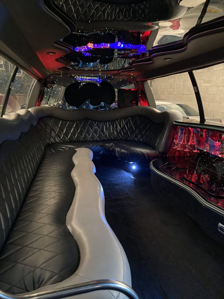 Limo interior with leather seating and bar, Luton
