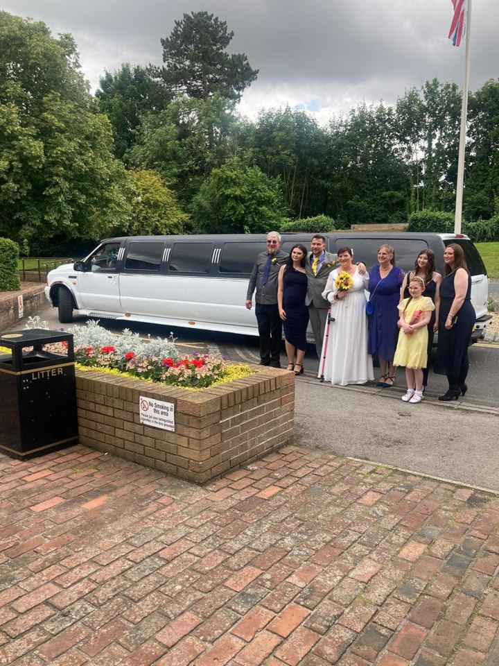 Wedding party posing with a stretch limo, York